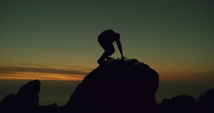 Woman, climbing and silhouette on hill at night, exercise and confidence for workout in outdoors. Female person, sky and fitness for wellness in nature, adventure and headlight in dark on mountain