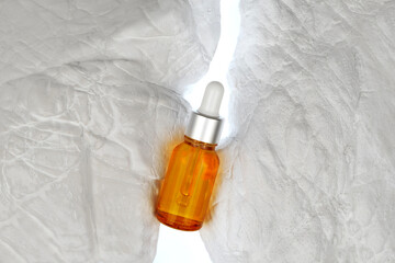 Dropper bottle on stone white background, minimal style mock up of beauty product packaging