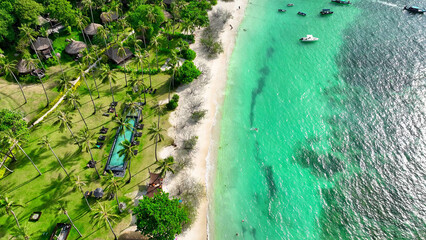 A picturesque shoreline adorned with verdant trees, cradled by pristine azure waves. A luxurious...