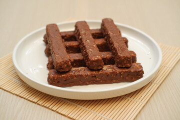 Chocolate wafers on a white plate, close-up
