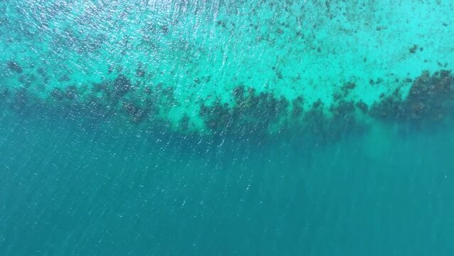 Nature of the beach and sea Summer with sunshine, sandy beaches, clear blue waters sparkling against the blue sky. On an island with good ecology and environment Background for summer vacation