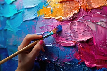 Close-up of a street artist painting a vibrant mural, adding color and life to an urban canvas