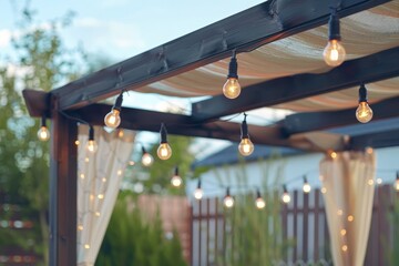 Textile awning and wooden frame gazebo with retro edison light bulbs glowing on sunny summer day in backyard - obrazy, fototapety, plakaty