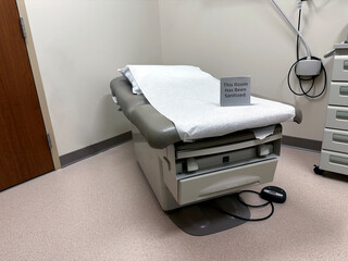 Examination or exam table in a doctors office in a medical clinic or hospital health care office.