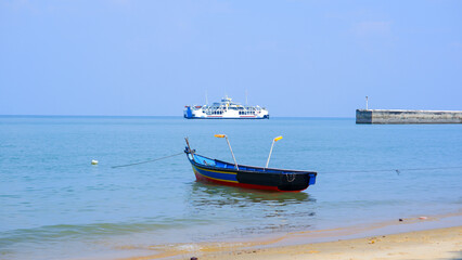 A Ferry Passenger Ship And Fishing Boat On The Coast Of Tanjung Kalian, Indonesia