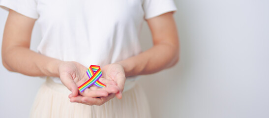 LGBT pride month concept or LGBTQ or LGBTQIA with rainbow ribbon for Lesbian, Gay, Bisexual,...