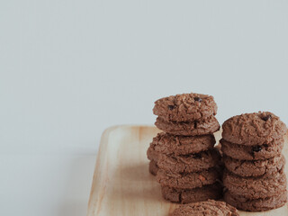 Brown cookies in a wooden tray are delicious for snacks.