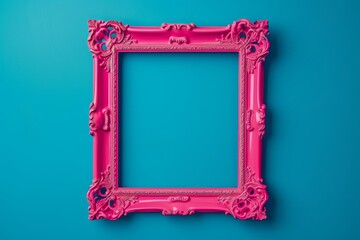 Pink empty frame isolated on vibrant blue Retro inspired backdrop Creative antique frame concept...