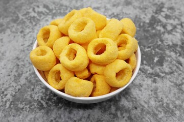 Cheese Ring Snack in bowl, close up high angle view