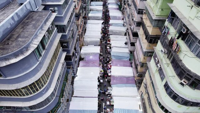  drone view Street market in Hong Kong between buildings
