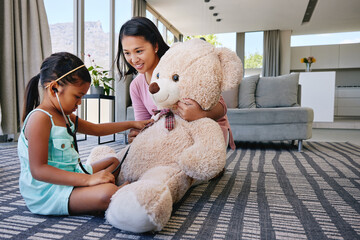 Woman, child and play doctor in house, healthcare and mother in family home with teddy. Girl,...