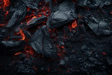 Foto auf Acrylglas Brennholz Textur Textured dark background with red streaked charcoal heat