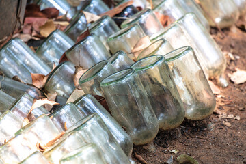 Glass bottles lie on the ground. Background
