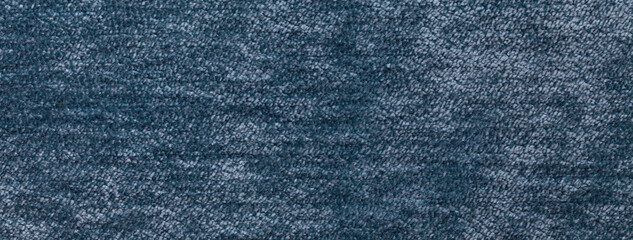 Texture of navy blue color background from textile material with pattern, macro. Vintage denim fabric cloth
