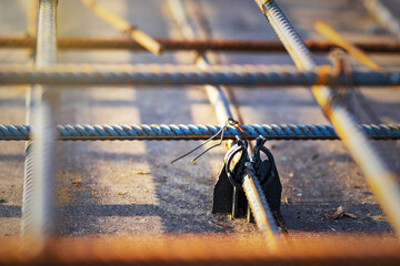 Black plastic reinforcing bar holders are used as formwork components in the construction of...