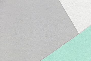 Texture of craft light gray color paper background with white and cyan border. Vintage abstract grey cardboard.