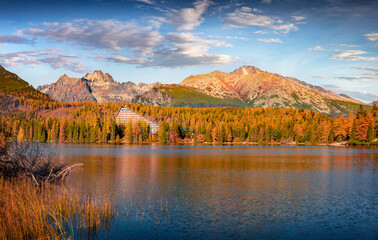 Colorful autumn view of Strbske pleso lake. Majestic morning scene of High Tatra National Park, Slovakia, Europe. Beauty of nature concept background.
