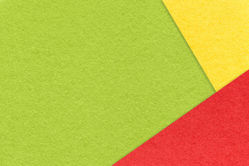 Texture of craft green color paper background with red and yellow border. Vintage abstract cardboard.