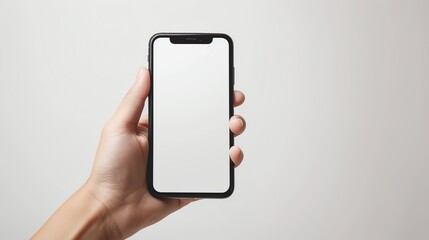 Close-up shot of a Caucasian hand holding a modern smartphone against a clean white background, ideal for tech product ads.