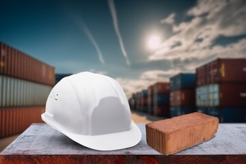 Protective worker helmet and building materials.