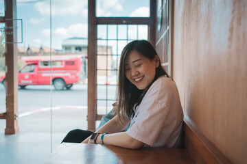 asian woman smile and happy during relax in coffee shop