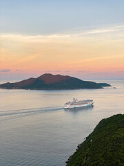  Serene Sunset Cruise by the Mountainous Island
