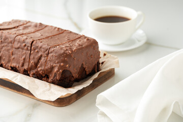 Fresh homemade chocolate sponge cake on wooden board