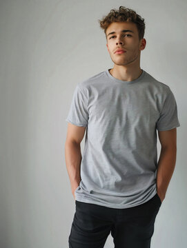 A man wearing a blank gray t-shirt mock-up, mock up for t-shirt design