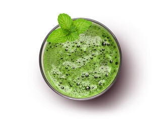 Glass of green smoothie juice with mint leaves isolated on white background, top view, flat lay. 