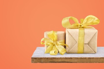 Luxury beautiful gift boxes with bow on color background.