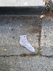 Lost white sock on the street