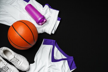 Basketball Gear Prepared for an Evening Training Session on a Dark Backdrop