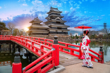 Japanese girl in traditional japanese kimono among Matsumoto Castle is one of the most complete and...