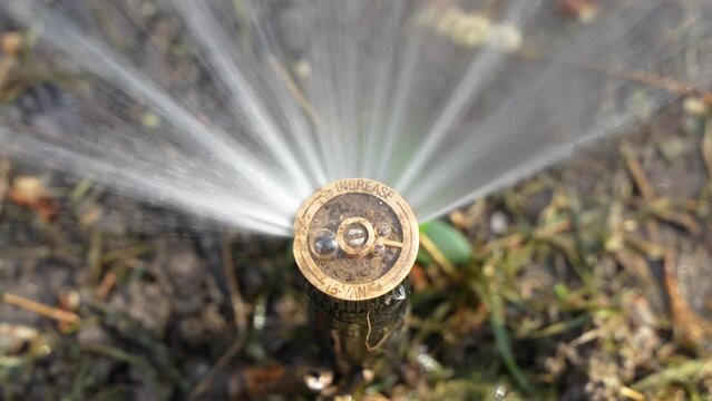 Garden maintenance lawn sprinkler rotating nozzle close-up