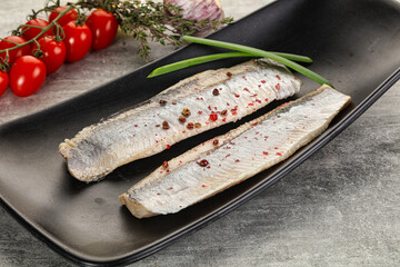 Marinated herring fillet with green onion