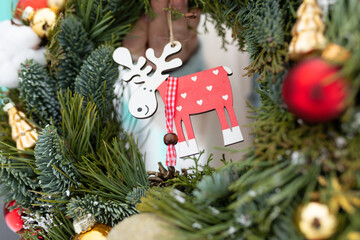 Close Up of a Christmas Wreath With Reindeer Ornament