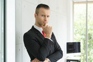 Portrait handsome businessman in office. - obrazy, fototapety, plakaty