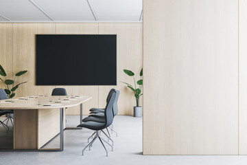 Modern wooden and concrete meeting room interior with furniture empty place on wall and black mock up screen. 3D Rendering.