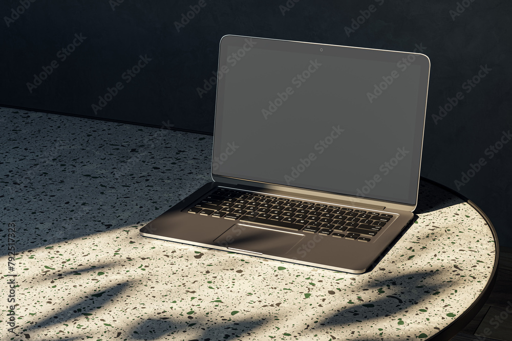 Poster Close up of modern designer desktop with empty mock up laptop on marble desk, sunlight and shadows. 3D Rendering.