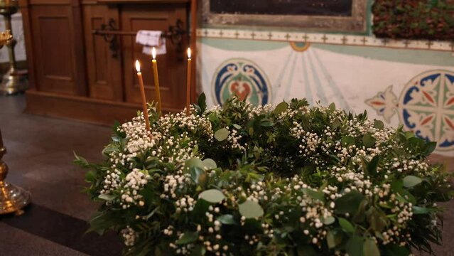 the baptismal font in the Orthodox church is decorated with flowers