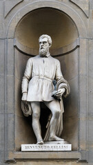 FLORENCE, ITALY-May 30,2023: Statue of Benvenuto Cellini in the niches of the Uffizi Gallery colonnade, Florence, Italy.