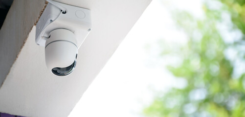 ip cctv camera which homeowner installed on high ceiling of the house to do the security instead of human at home, soft focus.