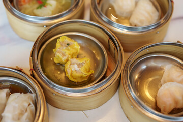 shumai or chinese steamed dumpling in dim sum set in restaurant