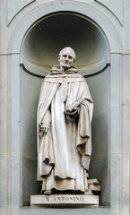 Statue of San Antonino in the niches of the Uffizi Gallery colonnade, Florence, Italy.