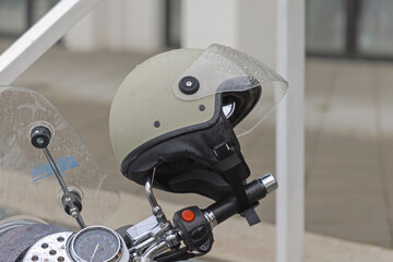 Wet Motorcycle Half Face Helmet With Visor at Rainy Day - obrazy, fototapety, plakaty