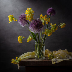 Modern still life with a bouquet of wildflowers on a dark background