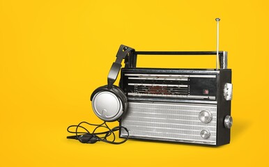 old radio on yellow background, music concept
