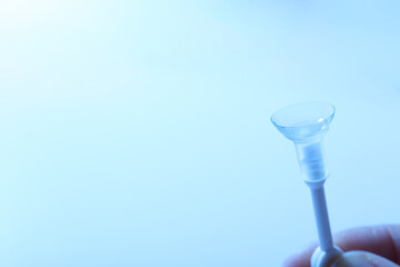 Transparent contact lenses for eyes on a blue background