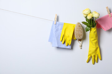Rubber gloves with flowers on a rope