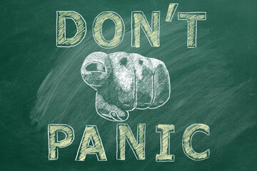 Closeup of a human hand pointing at you with lettering DONT PANIC. Illustration drawn in chalk on a greenboard.